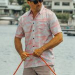 Close up of Tommy gamefishing button-up shirt showing marlin dolphin fish and wahoo design
